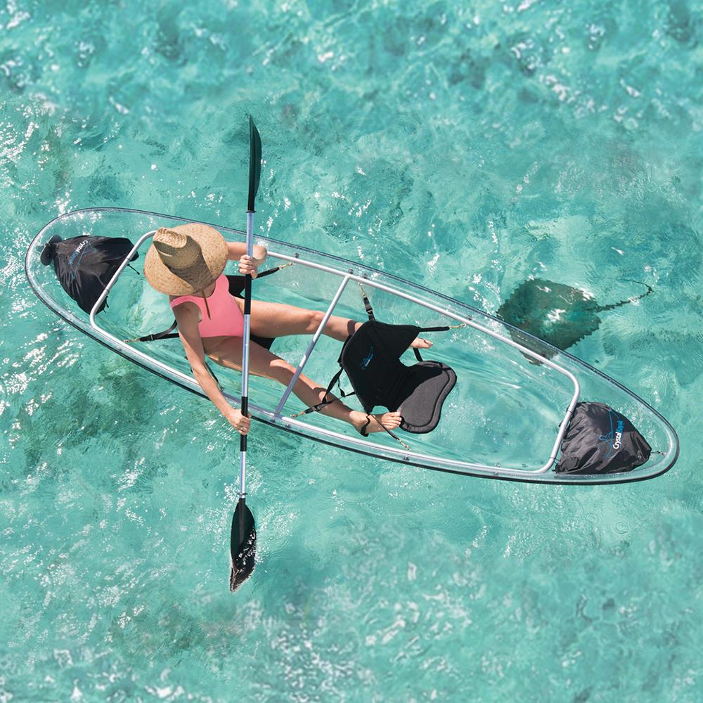 Transparent two-person kayak experience in clear turquoise water